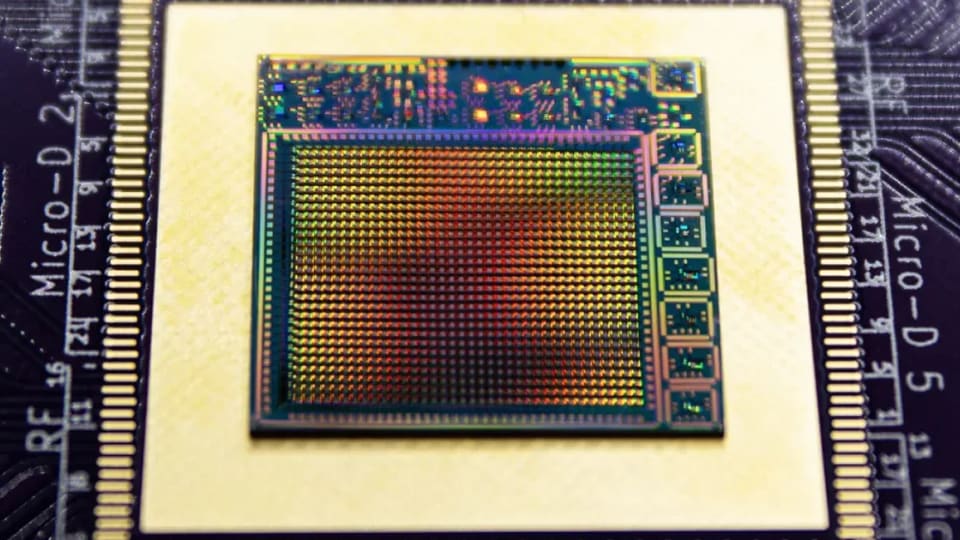 Close-up photograph of the experimental superconducting chip used for fusion-plasma data tests.