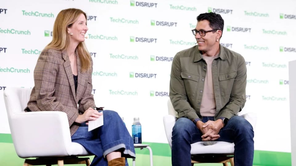 Kirsten Korosec and Rivian CEO RJ Scaringe seated onstage at TechCrunch Disrupt 2026.