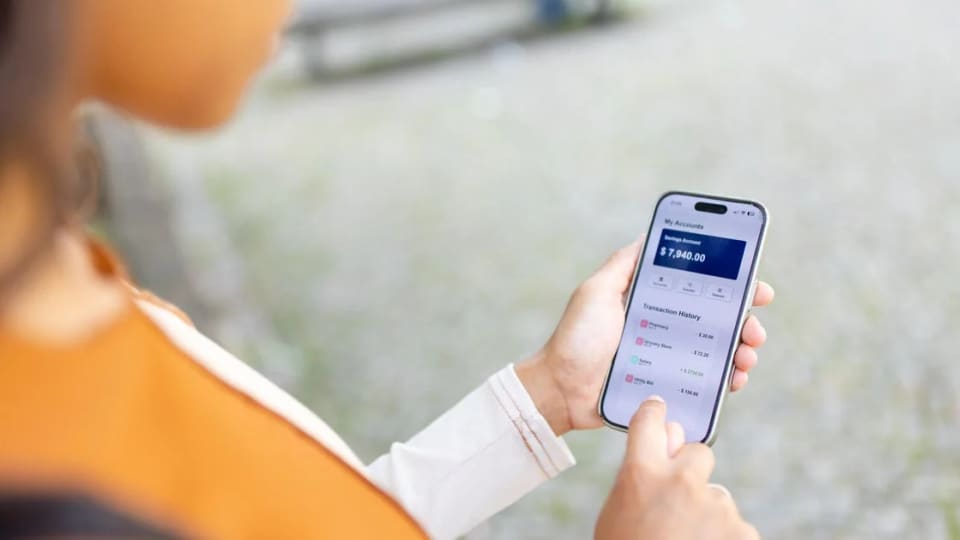 Person using a mobile banking application on a smartphone.